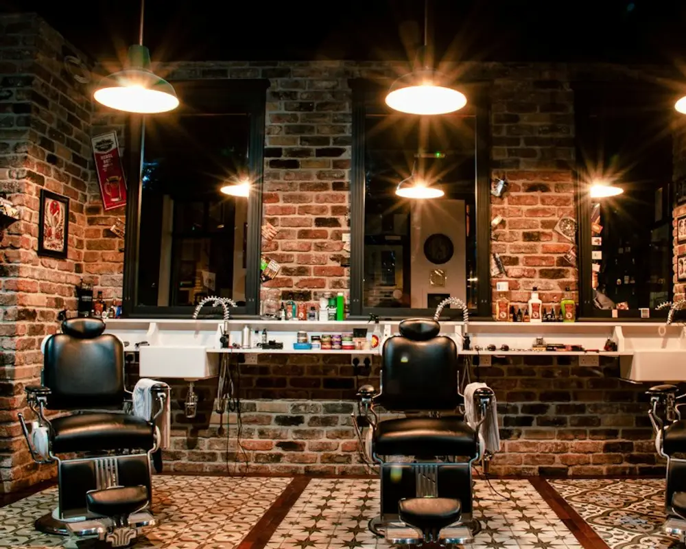 The interior of the barbershop with leather chairs