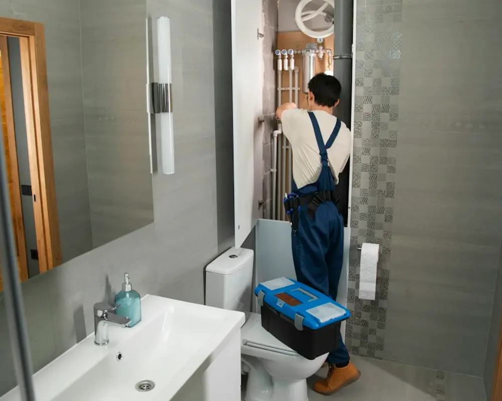 Plumber fitting out a new bathroom