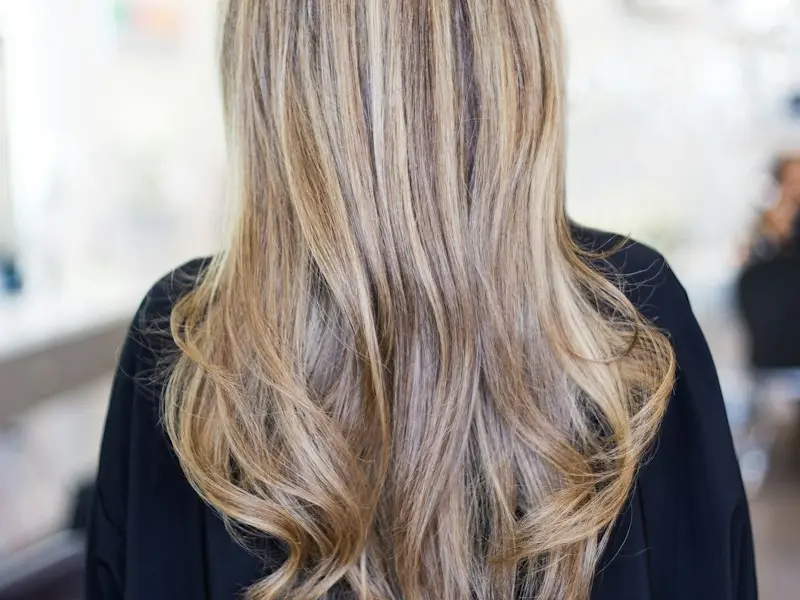 Long blonde balayage hair seen from behind